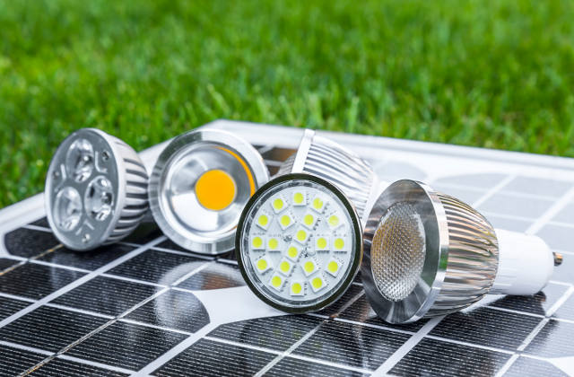 various GU10 LED bulbs on photovoltaics in the grass E27 LED and CFL bulbs